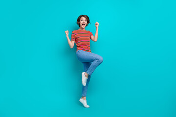 Full length photo of overjoyed cheerful woman celebrate victory casino jackpot lottery isolated on cyan color background