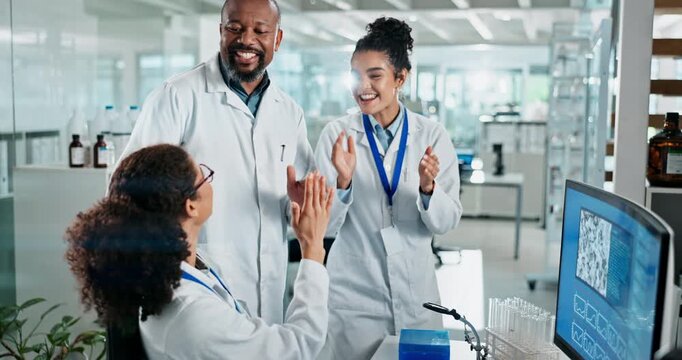 People, scientist and high five on computer in lab for investigation success, celebration and innovation discovery. Smile, team and pc notification of medical research, experiment funding and cure