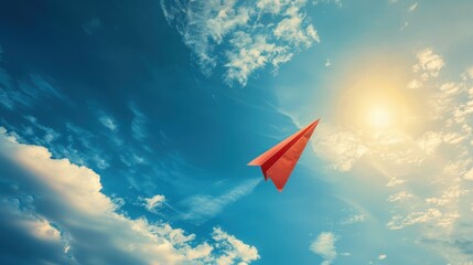 A paper airplane shaped like an arrow flying towards a bright sky, symbolizing creativity