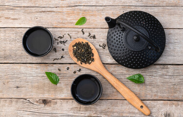 Green Tea with japanese teapot and leaves