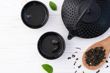 Green Tea with japanese teapot and leaves