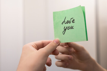 A sticker on the mirror that says “Love You”.
