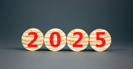 Business concept of 2025 new year symbol. Beautiful wooden circles with number 2025 Happy new year. Beautiful grey table grey background, copy space. Business 2025 happy new year concept.