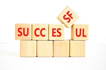 Successful symbol. Concept word Successful on beautiful wooden blocks. Beautiful white background. Business successful concept. Copy space.