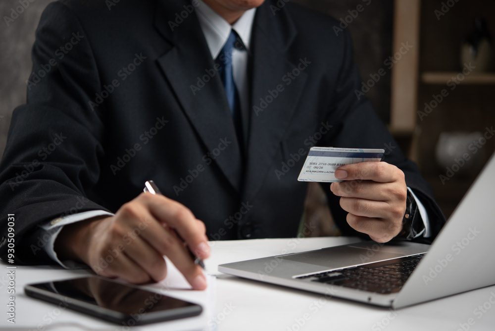 Poster businessman using a credit card to make an online payment, symbolizing secure digital transactions. 