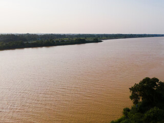 Aerial view of a vast yellow river.