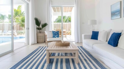 A white and blue striped rug is in the middle of a living room