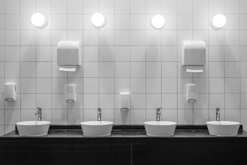 White colour ceramic tiles toilet hand wash area. White colour theme toilet interior. Cleanliness...
