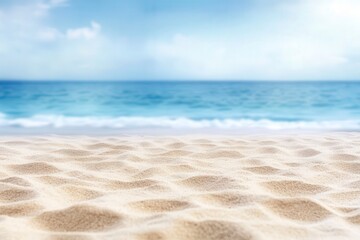 Fototapeta premium Serene beach scene with soft sand and a calm blue ocean under a bright sky, perfect for themes of relaxation, summer, and tranquility.