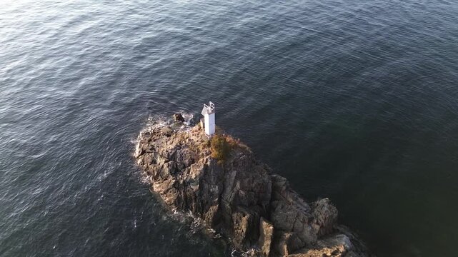 Top view of Cape Roger Curtis Lighthouse at Bowen Island at sunset in British Columbia