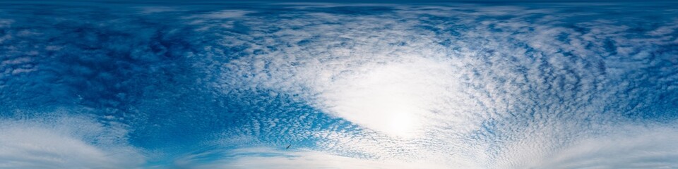 Sky 360 panorama - Bright blue sky filled with fluffy white Cirrus clouds. Seamless hdr spherical 360 panorama. Sky dome sky replacement for aerial drone 360 panoramas. Weather and climate change