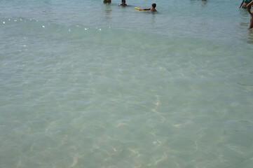 Fototapeta premium people walking on the beach