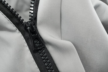 Silver lock with black zipper on clothes close-up. Zipper © Gudman
