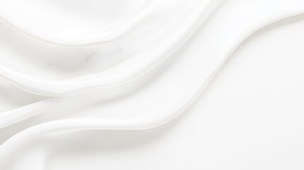 Obraz premium White fabric flows softly, creating smooth curves against a pristine background, highlighting elegance and minimalism in design
