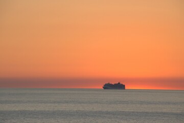 Cruise ship at sunset off Bari coast