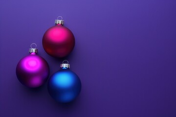 Obraz premium Three colorful Christmas balls on purple background