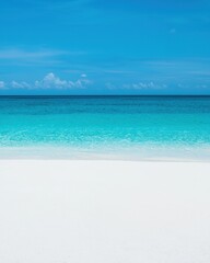 A serene beach scene featuring soft white sand and calm turquoise waters under a clear blue sky. Perfect for vacation themes.