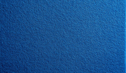 Close-up of a textured blue fabric surface.