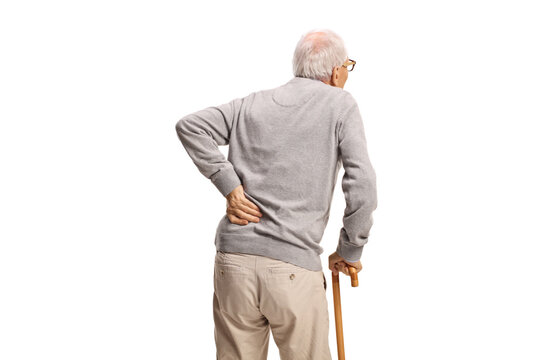 Rear view shot of an old man with a cane holding his back