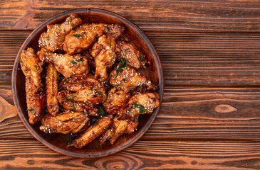 Caramelized in sause chicken wings  . Bar-b-q food background photo