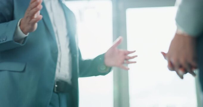 Business, people and handshake in office with discussion for final agreement, trust establishment and understanding. Man, woman and shaking hands for formal partnership, collaboration and cooperation