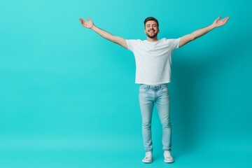 Happy man showing empty space on blue backdrop, demonstrating with joy and cheerfulness