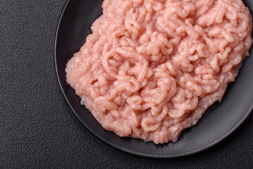 Fresh raw chicken mince with salt and spices
