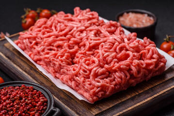 Fresh raw ground beef with salt and spices
