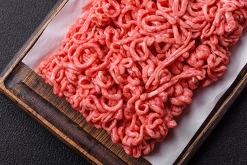 Fresh raw ground beef with salt and spices