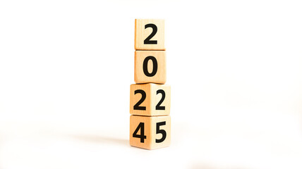 Business concept of 2025 new year symbol. Beautiful turned wooden cube and changed number 2024 to 2025. Beautiful white table white background, copy space. Business 2025 happy new year concept.