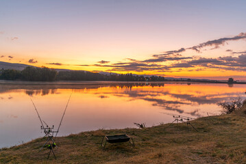Carp fishing rods at sunrise.