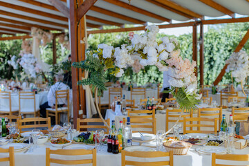 Elegant wedding table arrangement with candles and flowers