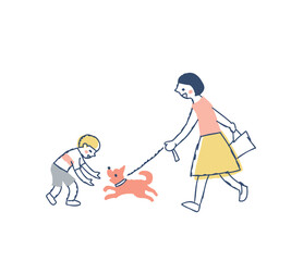 散歩中の犬と遊ぶ男の子