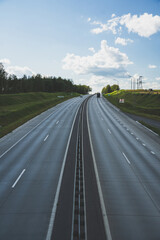 Highway view from above. Cars drive on the highway. Traffic of cars