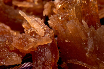 Close-up of traditional Salvadoran Chilacayote candy, a sweet, caramelized dessert enjoyed during festive August fairs.