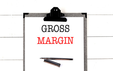 GROSS MARGIN text on clipboard on white background