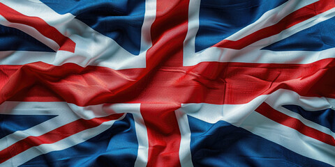 Proudly waving UK flag symbolizes british patriotism and identity, evoking pride and freedom with its dynamic fabric texture.Silk texture of the UK flag. Banner