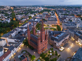 Aerial Drone Shot of Cathedral at Marktkirche in Wiesbaden, Germany. Old town and the city center at Evening Twilight.