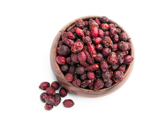 Dry berry Rose hips in wooden bowl isolated on a white background