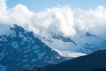 beautiful mountainous landscape, mountain range among clouds