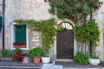 Fototapeta premium Facade of an old house in Lazise town on shore of Lake Garda, Italy, Europe.