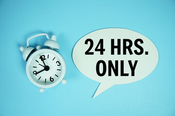 24 Hrs only text on speech bluble with alarm clock top view on blue background
