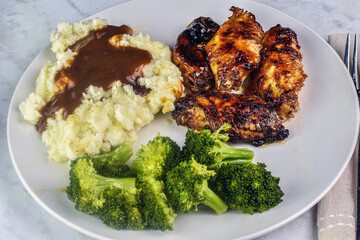 barbecue wings with  mash potatoes and gravy