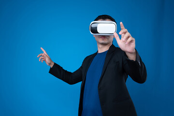 Profile businessman wearing VR headset looking to connect metaverse touching zoom in or out interesting business data isolated blue background futuristic technology in virtual reality. Contrivance.