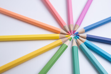 Fototapeta premium Colored pencils on colored background. Back to school concept. Draw