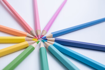 Fototapeta premium Colored pencils on colored background. Back to school concept. Draw