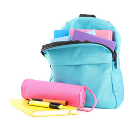 Backpack with different school stationery isolated on white