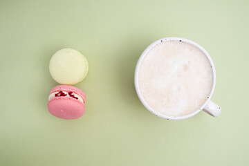 Macarons on a colored background, French cookies. Gift for March 8, International Women's Day, Valentine's Day. Sweets for coffee and tea