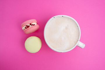 Macarons on a colored background, French cookies. Gift for March 8, International Women's Day, Valentine's Day. Sweets for coffee and tea
