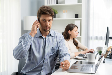 Office worker smart man using phone call to customer or manager, looking at camera photo shooting...